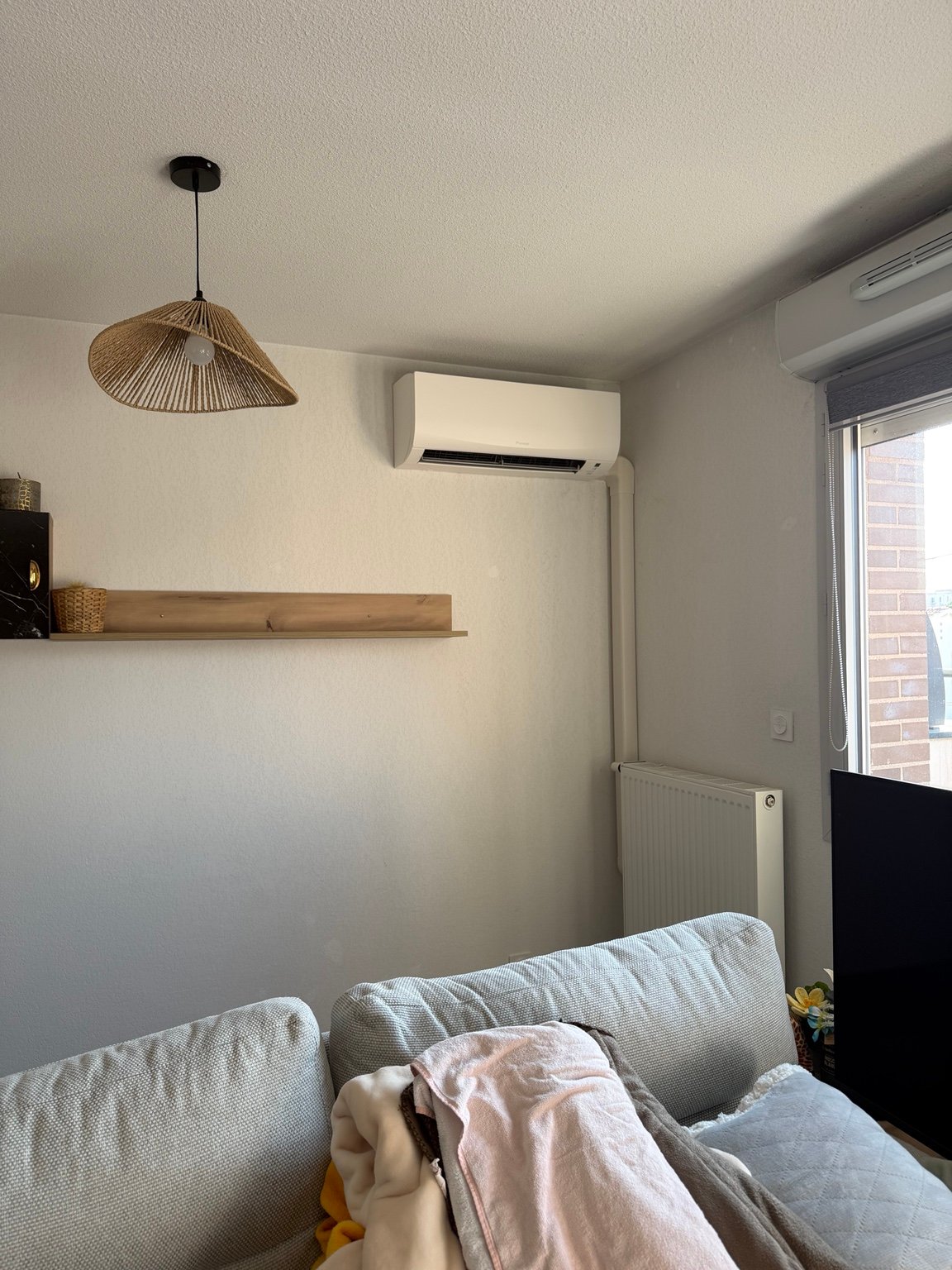 Installation de climatisation murale réalisée par PureXpert Confort